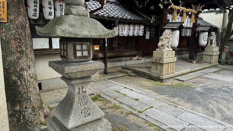 The shrine's stone lanterns and guardian dogs